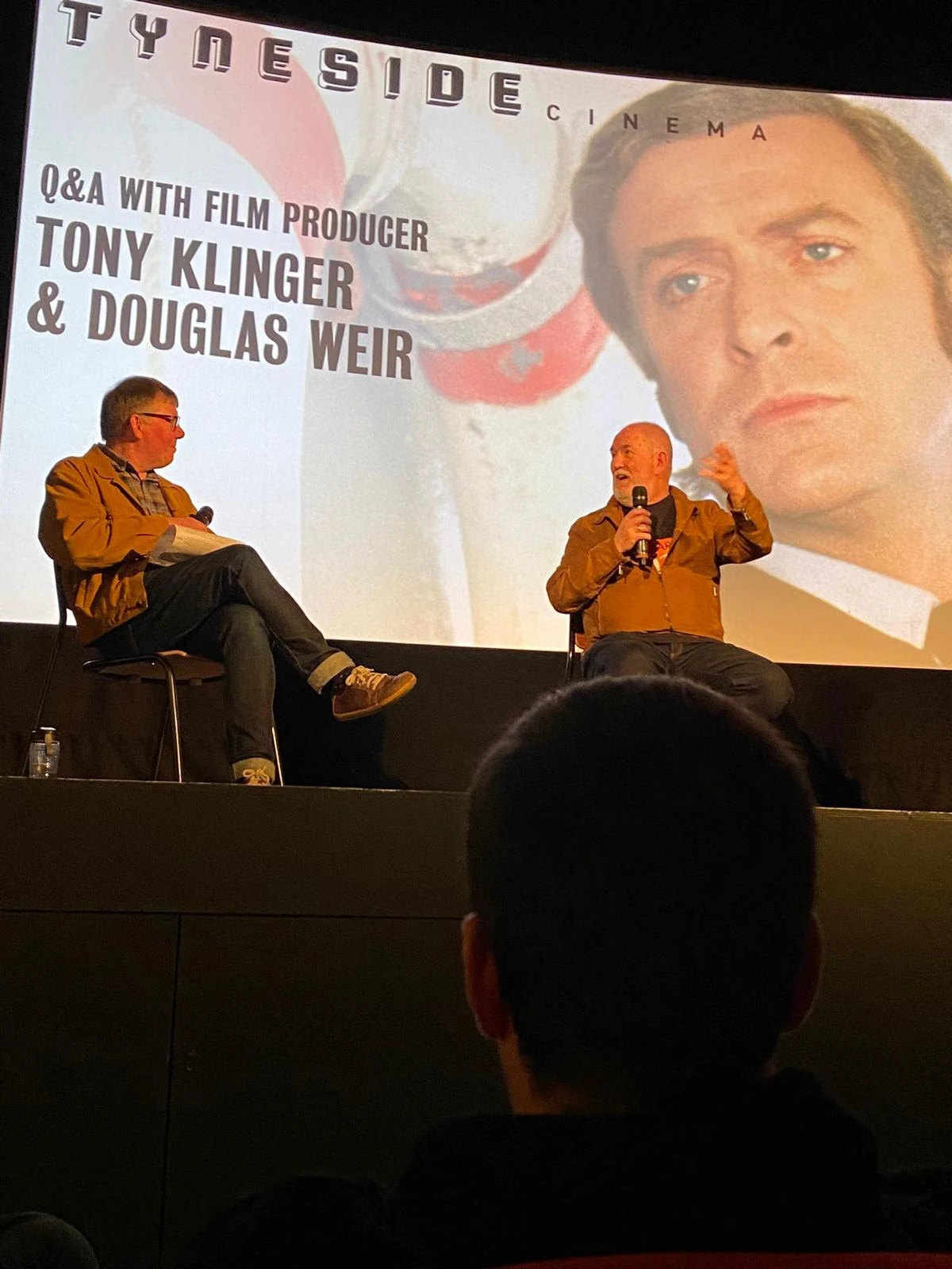 Tony Klinger on stage at a Q&A at Tyneside Cinema, seen from the audience